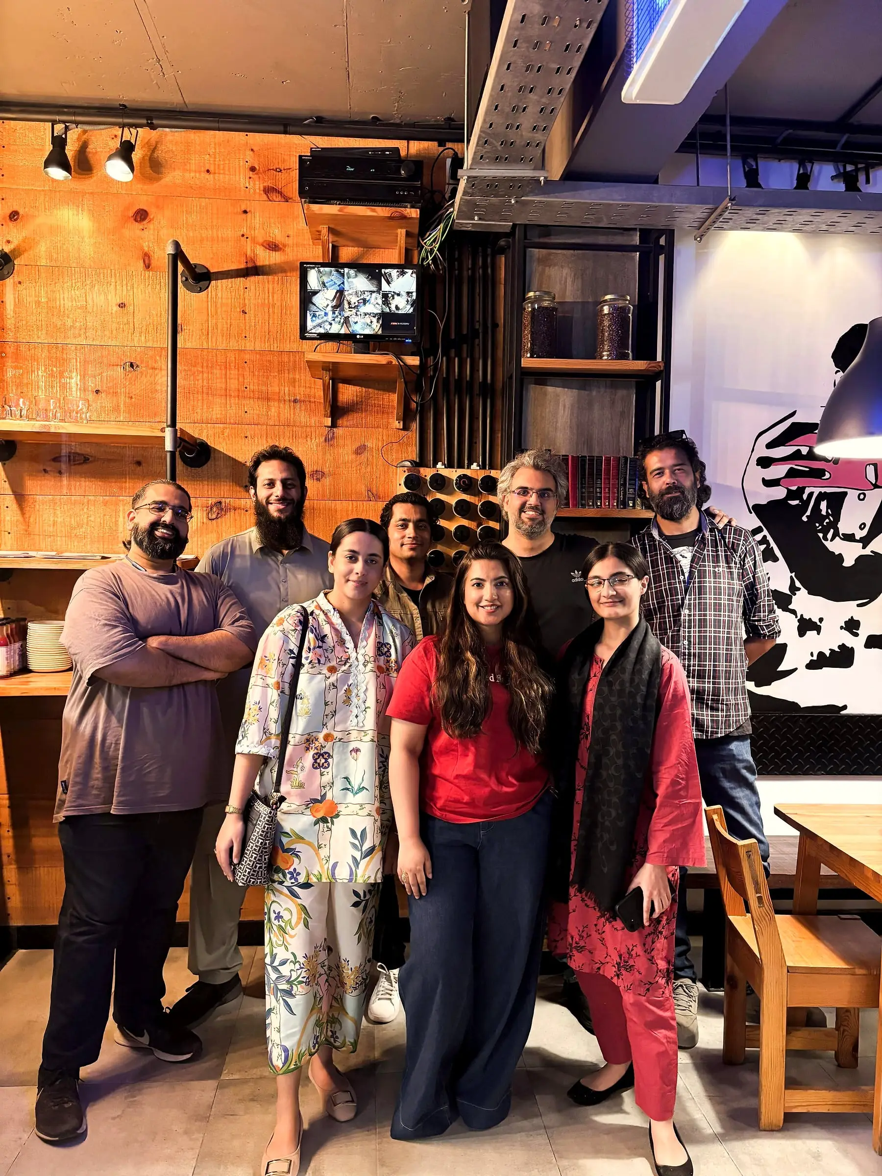 Usman with founders and builders at a meetup in a cafe