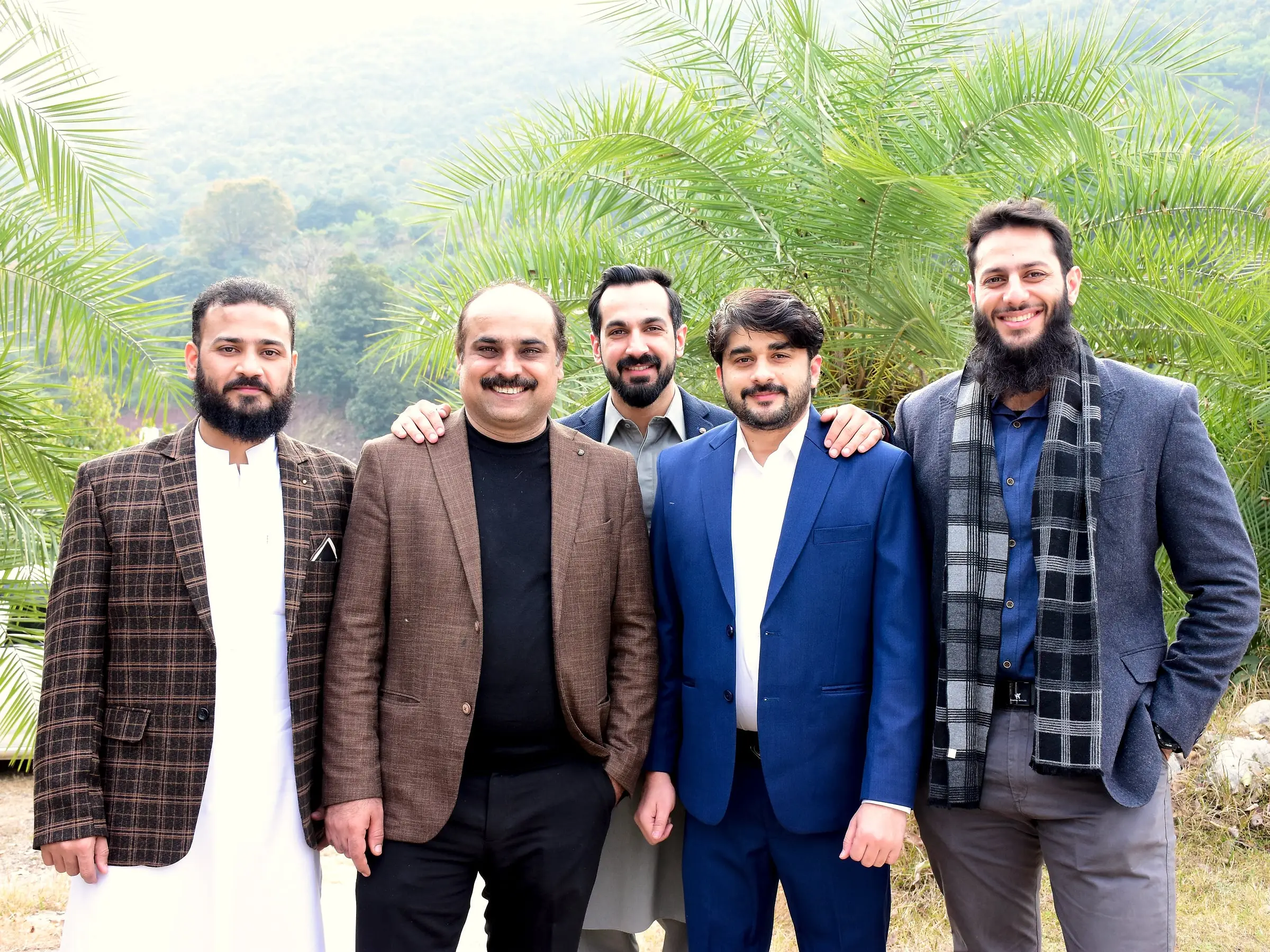 Usman outdoors with four colleagues